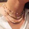 BOHM PARIS | Collier Killian Love -beige kesäkoru simpukkahelmin