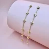 FRENCH RIVIERA | Étoile Earrings -pitkät tähtikorvakorut (kulta)