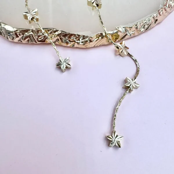 FRENCH RIVIERA | Étoile Earrings -pitkät tähtikorvakorut (kulta)