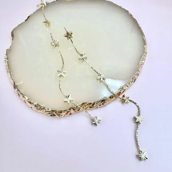 FRENCH RIVIERA | Étoile Earrings -pitkät tähtikorvakorut (kulta)