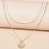 Kerroskaulakoru, FRENCH RIVIERA | Delicate Pearl Layer Necklace in Gold