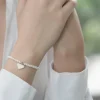 PREMIUM COLLECTION | Kristina -hopeinen helmirannekoru sydämellä