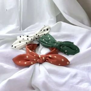 SUGAR SUGAR®, Lyla Hairband -koralli comfy-hiuspanta rusetilla