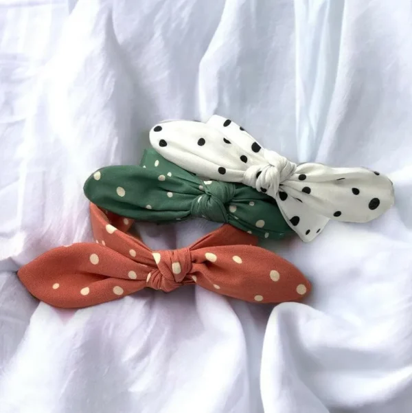 SUGAR SUGAR®, Lyla Hairband -koralli comfy-hiuspanta rusetilla