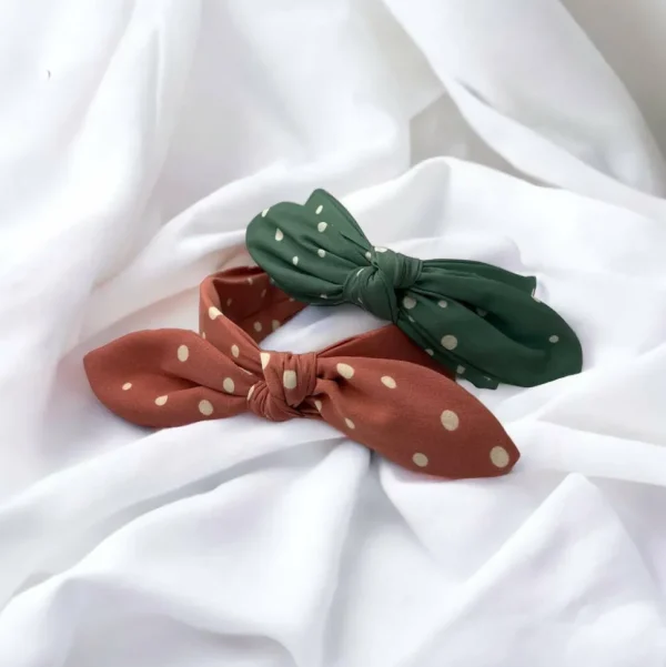 SUGAR SUGAR®, Lyla Hairband -koralli comfy-hiuspanta rusetilla